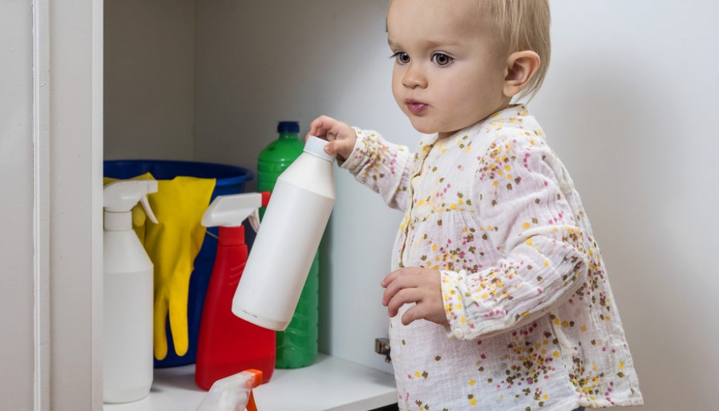 Toddler,Playing,With,Household,Cleaners,At,Home